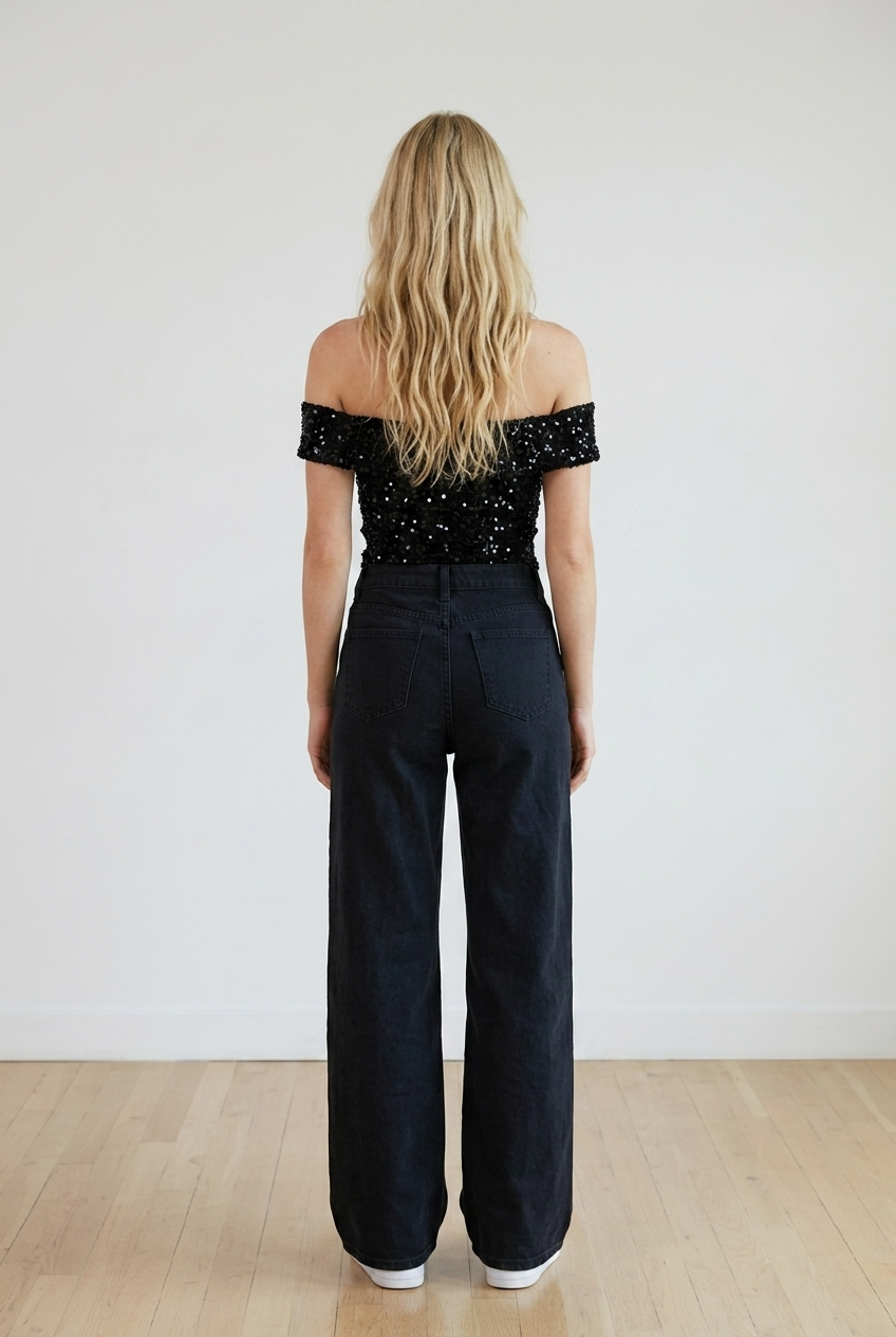 Jeans donna palazzo nero con strappi sulle ginocchia, modello high-waist
