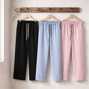 Pantalone palazzo con vita elasticizzata, coulisse regolabile, tasche laterali e gamba ampia